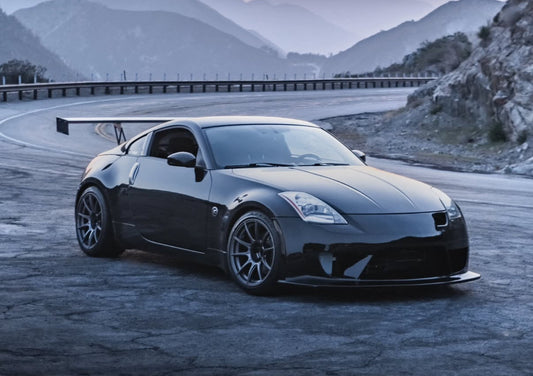 James’ silver 2005 Nissan 350Z track car with a wide square wheel setup and large rear wing, prepared for SCCA and NASA Time Trial competition.